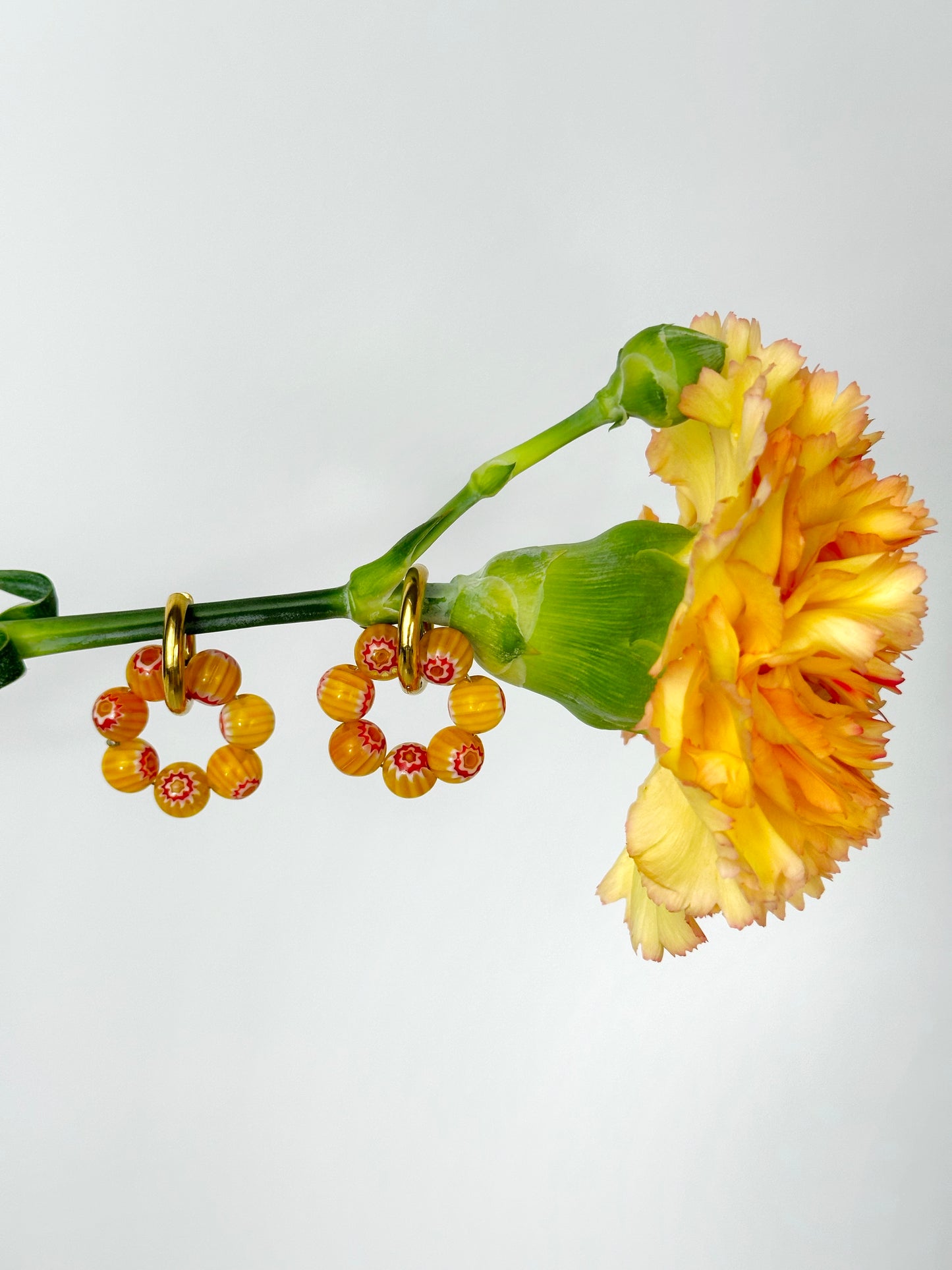 Millefiori yellow charms